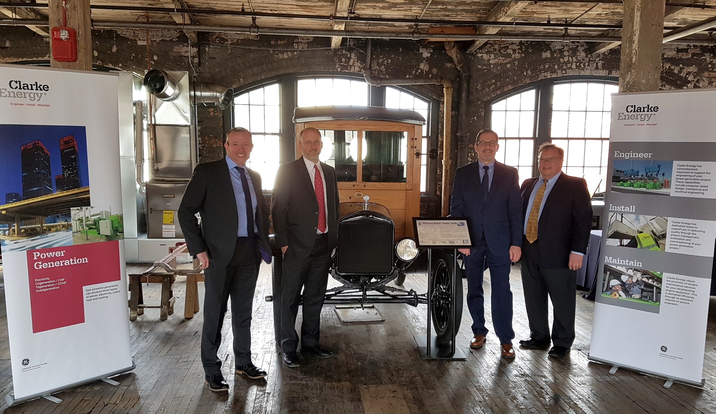 A photograph of Clarke Energy's US team members (l-r Chris Hayhurst, Business Development Director, Jon Going, Sales Director, Chris Bixby, Sales Engineer, Charlie Mayer, Sales Engineer) and historic Ford motorcar