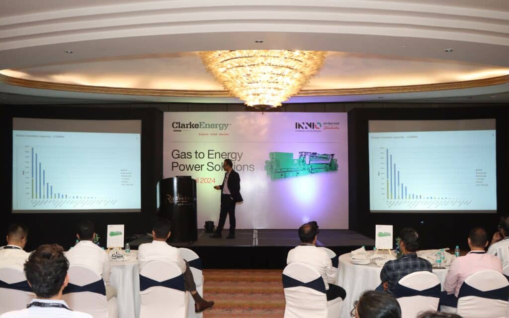 Clarke Energy's Gas to Energy Power Solutions Workshop. Speaker is on the stage delivering the presentation to a room full of Jenbacher engine users.
